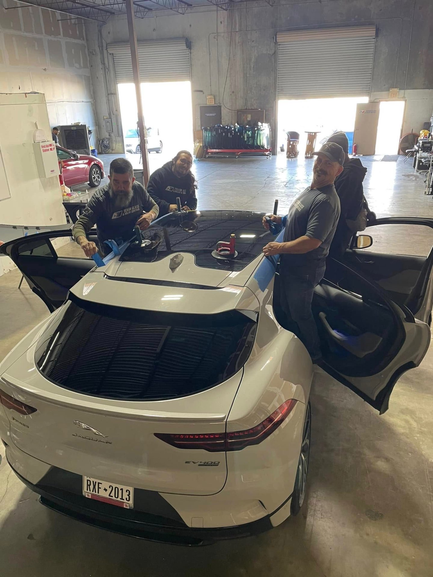 Our certified team installing a fresh windshield